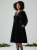 sukienka-velvet-star-aksamitna-plus-size-czarna-dekolt-v-rozkloszowana-z-kieszeniami-cyrkonie-blyszczaca-elegancka-butik-szykownia-3