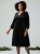 sukienka-velvet-star-aksamitna-plus-size-czarna-dekolt-v-rozkloszowana-z-kieszeniami-cyrkonie-blyszczaca-elegancka-butik-szykownia-5