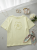 bluzka-kwiat-3d-latynka-pastelowy-zolty-tshirt-damski-bawelna-elastan-aplikacja-kwiat-3d-krotki-rekaw-polska-produkcja-rozmiary-standardowe-i-nadwymiary-modna-bluzka-damska-wiosna-butik-szykownia-3