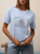 bluzka-tshirt-botanika-lemonada-niebieska-baby-blue-bawelna-98-elastan-kwiatowy-nadruk-botanique-lete-naturalne-piekno-premium-polskiej-produkcji-modna-bluzka-damska-wiosna-butik-szykownia-1