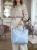 ines-delaure-168168-torebka-damska-baby-blue-duza-a4-z-kosmetyczka-eko-skora-stalowe-okucia-pasek-krotki-dlugi-elegancka-torebka-damska-na-co-dzien-do-pracy-modna-torba-butik-szykownia-4
